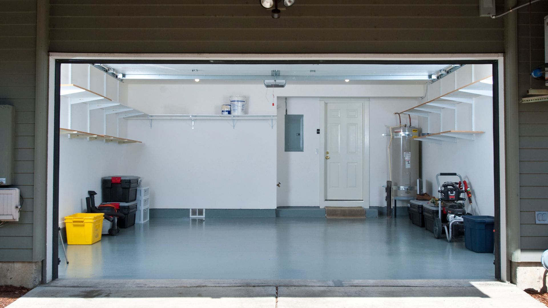 The inside of a garage with a white door