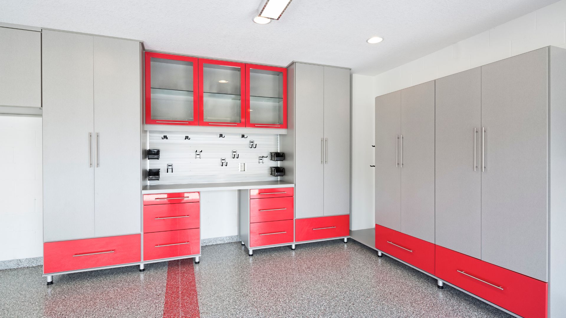 A garage with a lot of cabinets and drawers