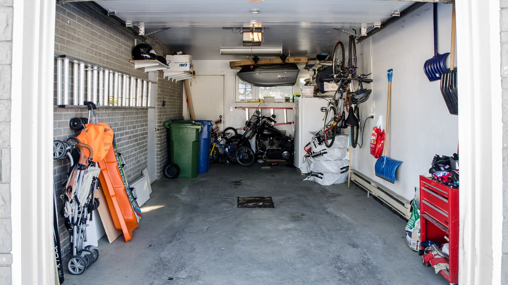 A garage filled with lots of different types of bikes